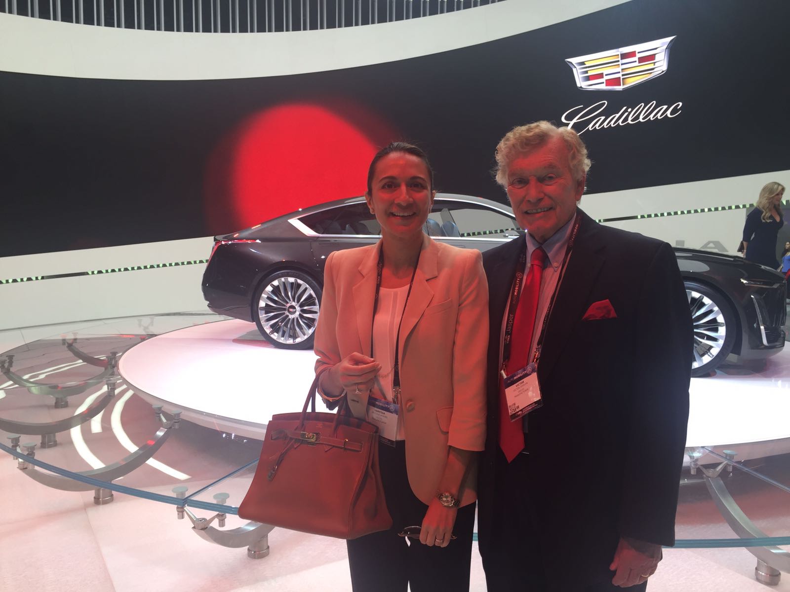 LIASE Group Managing Partner Asia, Vanessa Moriel, and Non-Executive Board Member, Vic H. Doolan, pose for a picture in front of the Escala Concept at the LA Auto Show. 