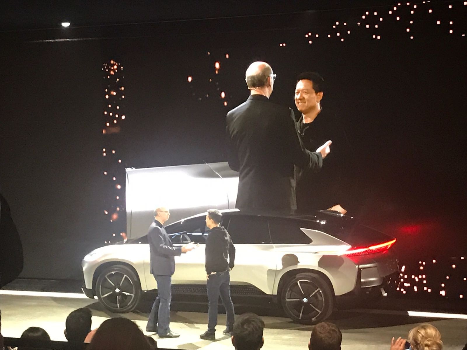 Nick Sampson, SVP of R&D & Engineering for Faraday Futures welcomes Jia Yuetieng, Chief Executive Officer of LeEco to the stage during their press conference at CES 2017. 