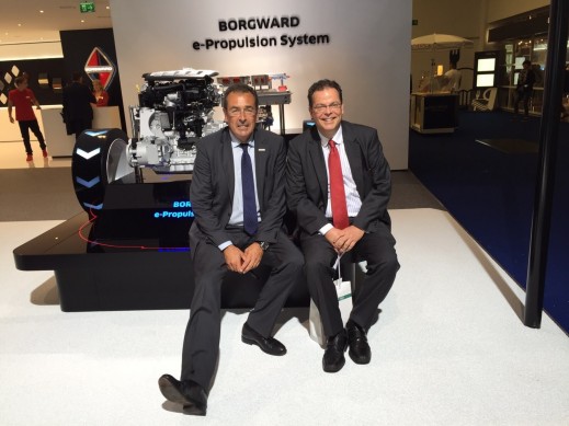 Automobilwoche Managing Director Helmut Kluger (left) posing next to LIASE Group President and Managing Director Europe Wolgang Doell in front of a Borgward engine. 