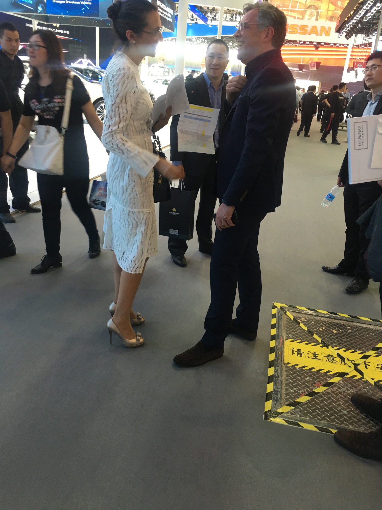Vanessa Moriel exchanges a few words with a Volvo Global Executive during the press day at the Beijing Auto Show.