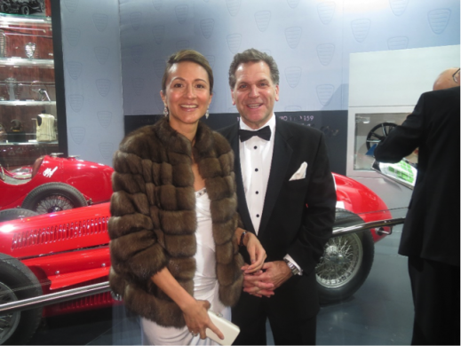 Vanessa Moriel and John Bukowicz pose in front of Alfa Romeo on the evening of the Black Tie Gala. 